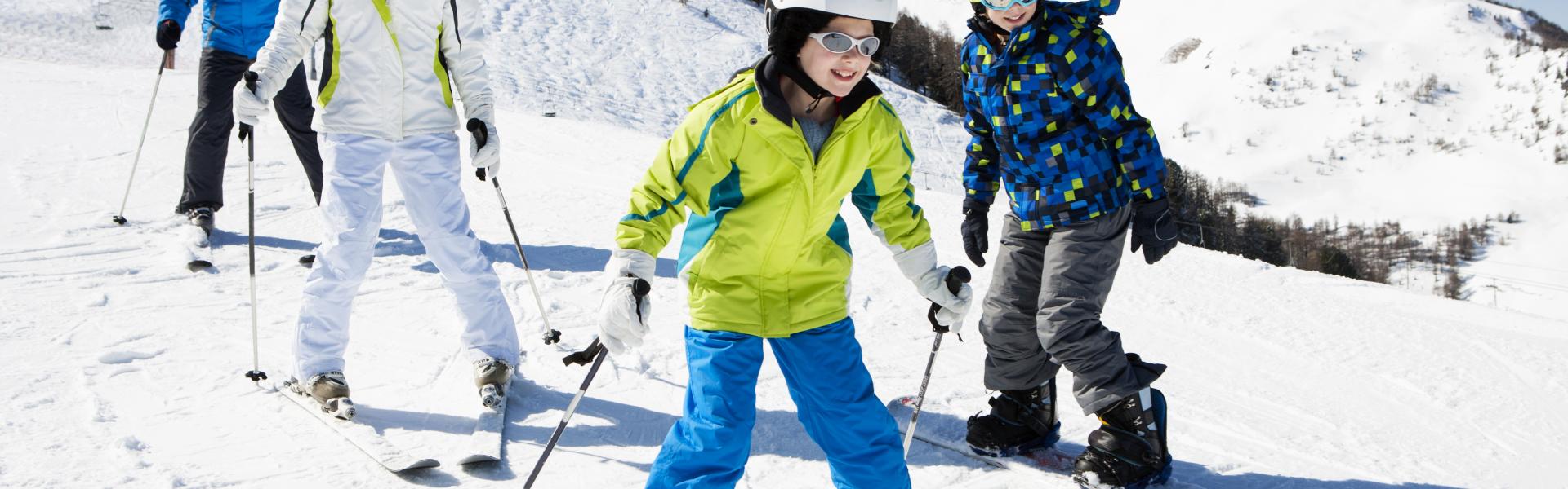 Happy Family skiing outdoors