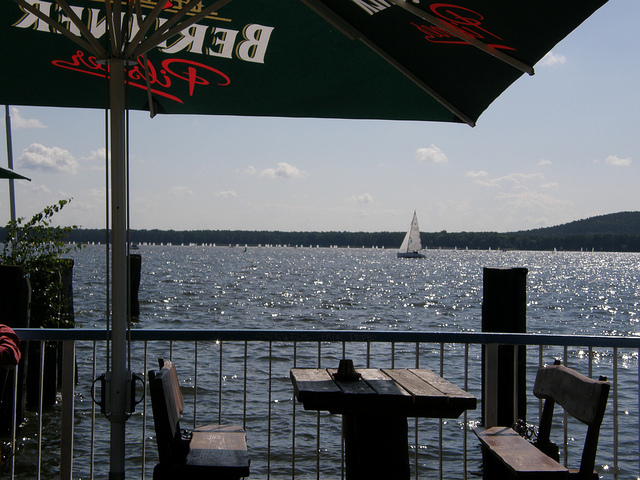 Overlooking a sailing boat on Müggelsee Overlooking Müggelsee