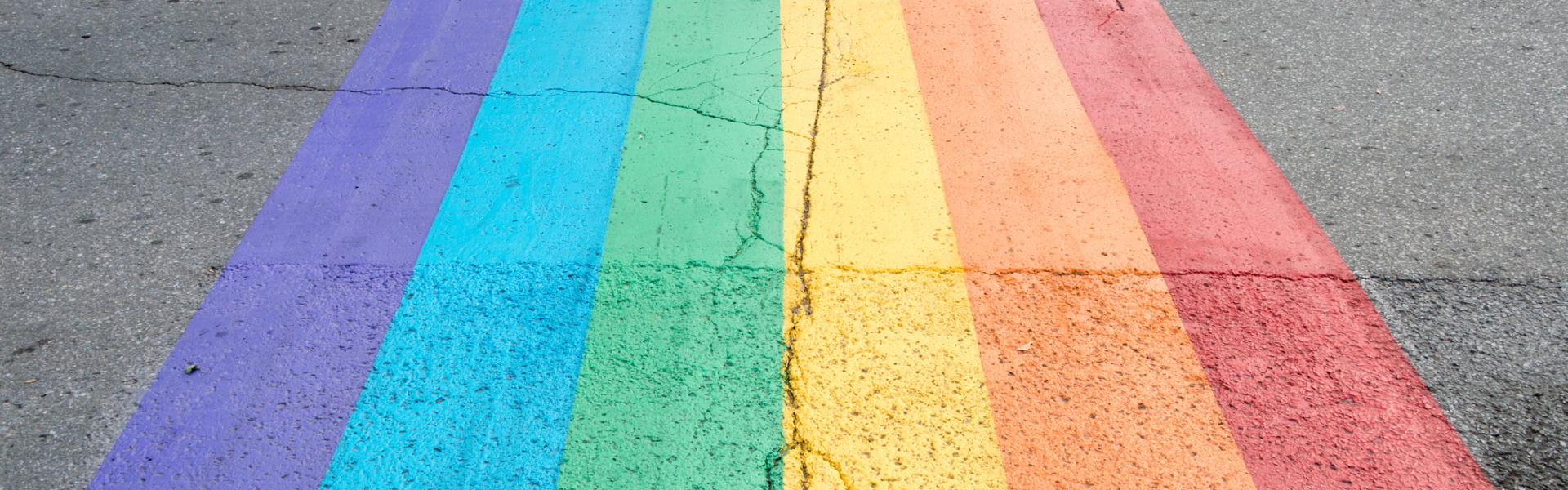 A rainbow flag painted onto the road 