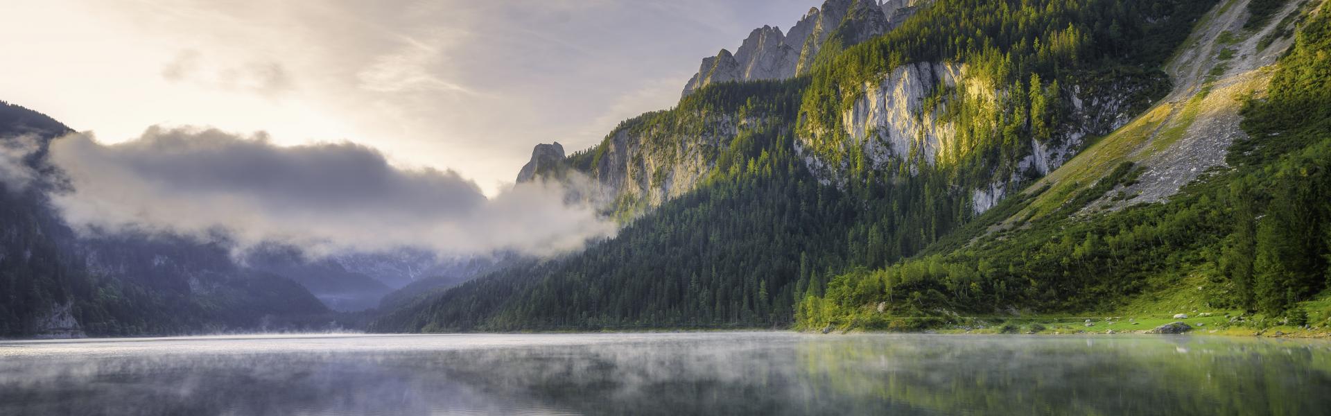 Fantastic Sunrise Scene with Fog Over Lake at azure alpine lake Vorderer Gosausee. Gosau valley in Upper Austria