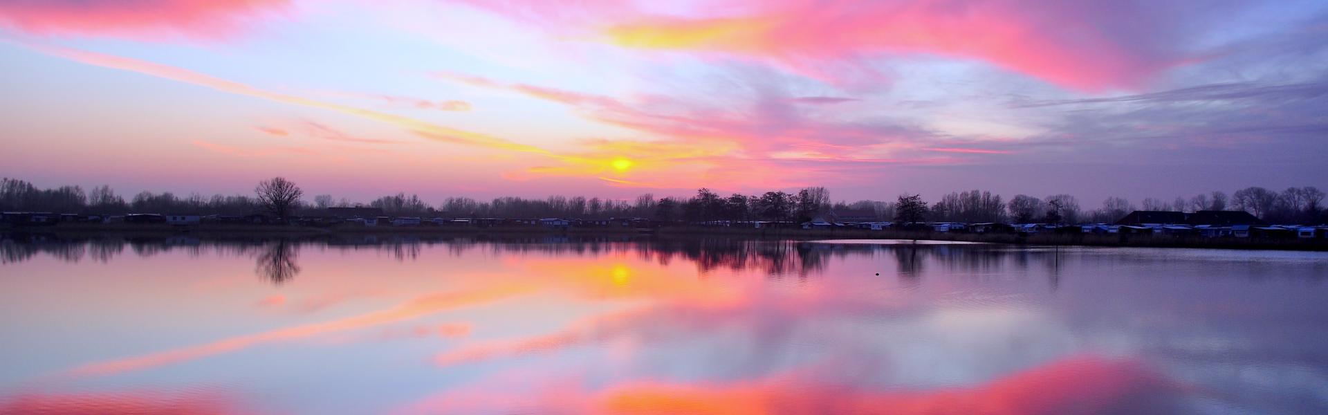 Beautiful purple and pink horizon sunrise in the sky in Cuxhaven.