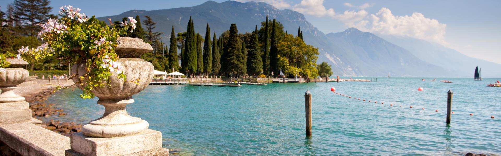 View on the bay of Riva del Garda and mountains in background, Lake Garda, Italy.