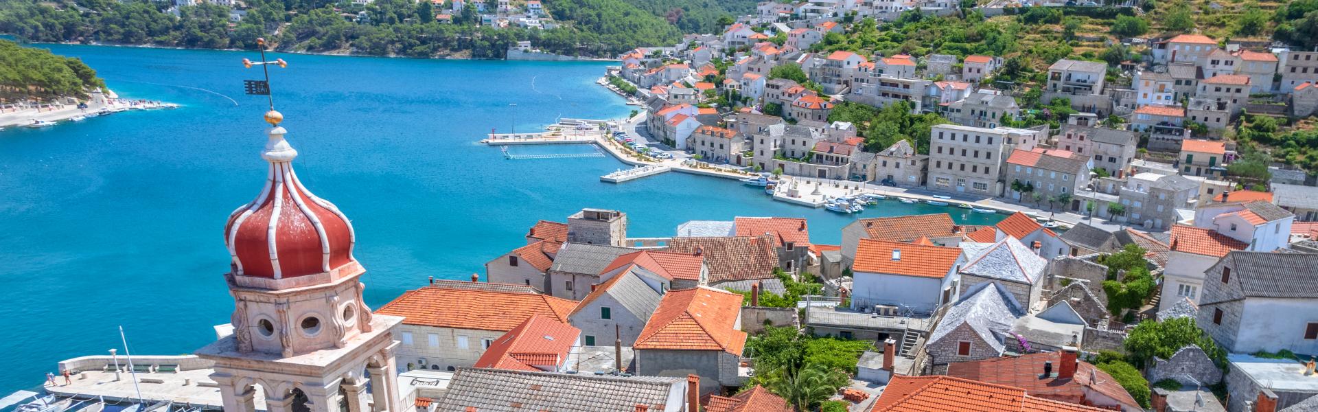 High angle view of the harbor town of Pucisca, one of the prettiest villages in Europe, on Brac island, Split-Dalmatia County, southern Croatia.