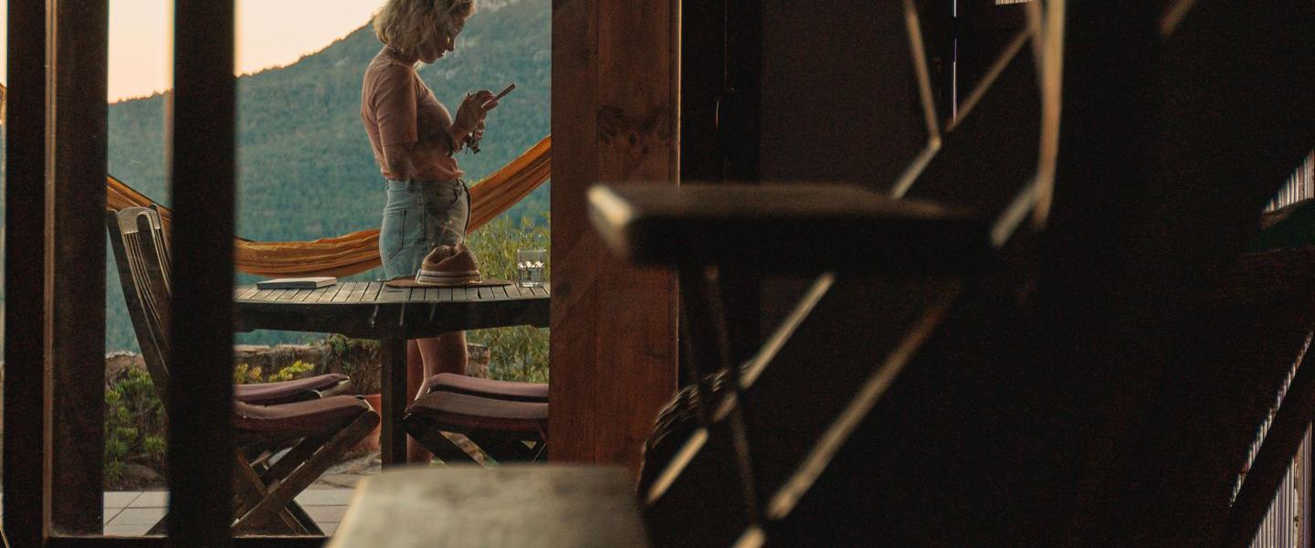 Woman on the balcony of a vacation rental