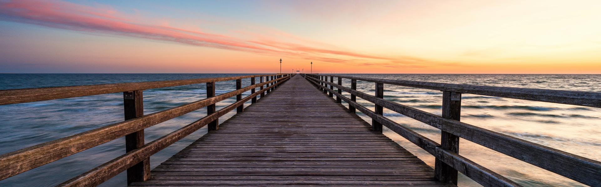 a wooden walkway over water