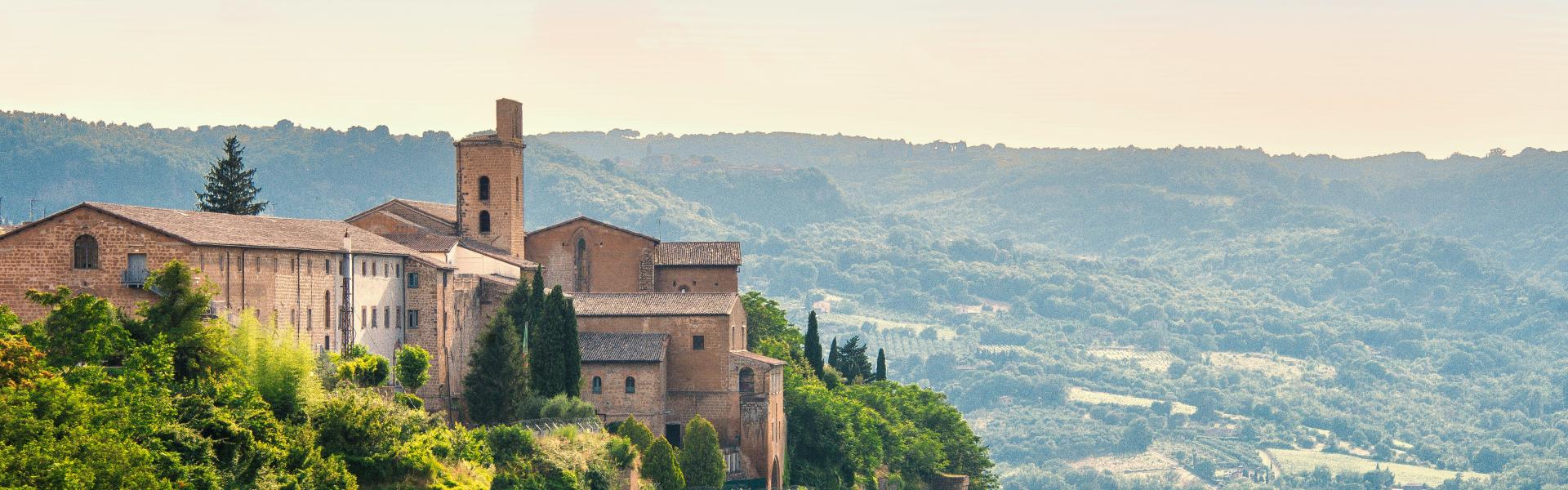 A clifftop town in Italy, surrounded by nature