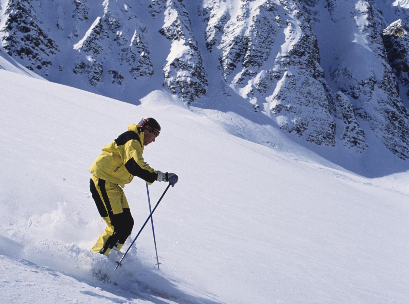 Skier carving down Marmot Basin