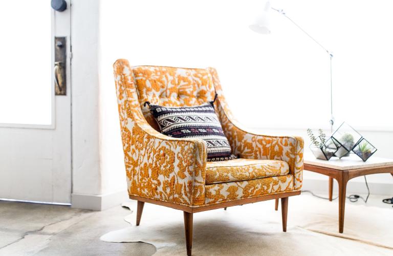 Elegant armchair in mustard yellow