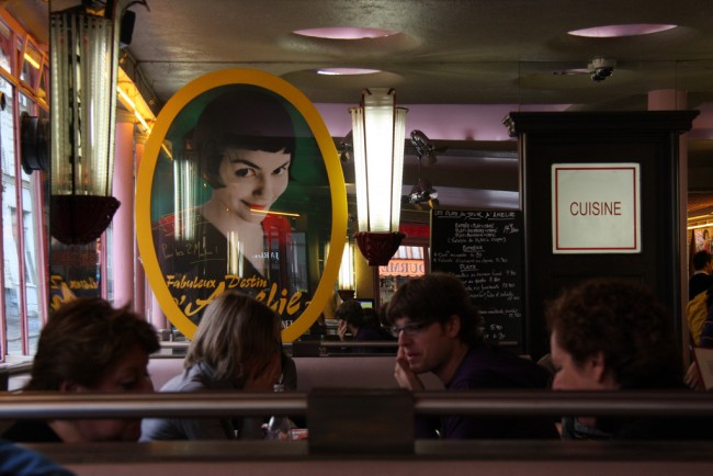 A poster of the film Amelie in a cafe