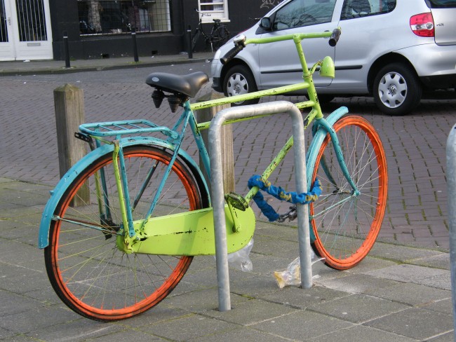 Amsterdam bike chained to a railing