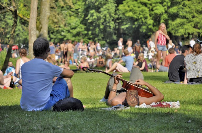 Young people on a summerday in the Vondelpark in Amsterdam