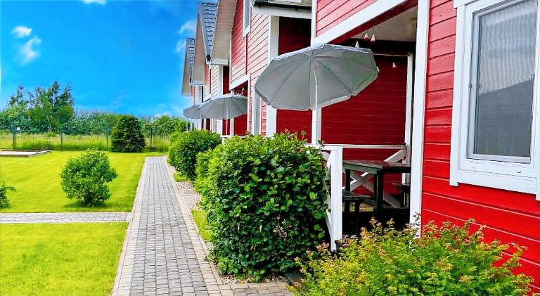 Lodge with BBQ, yard & terrace in Darlowo