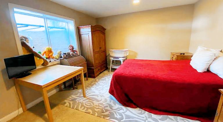 Private basement bedroom with private bathroom, kitchen, and living room with large screen televisio — photo 2