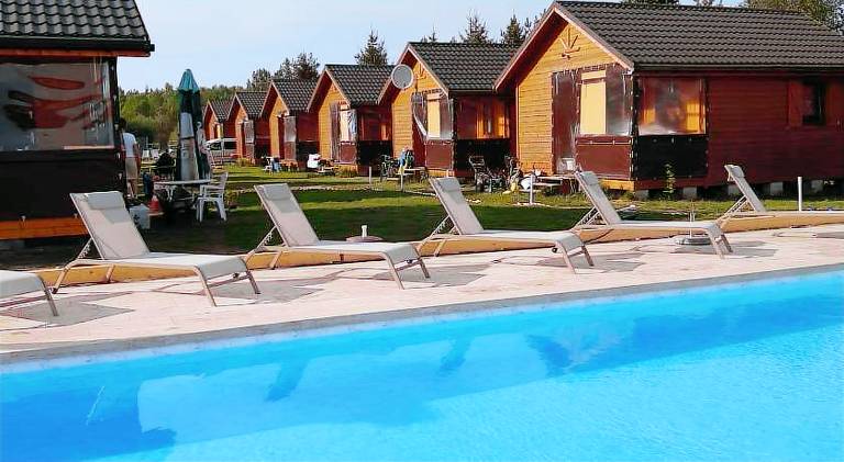 Lodge with terrace, yard & pool in Darlowo