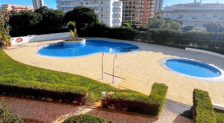 Apartment with patio, yard & private pool in Portimão