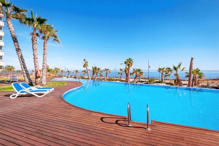 Holiday apartment with patio & heated pool | Garden view — photo 2