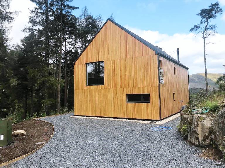 An Caisteal Lodge with cascading waterfall view in Stirling