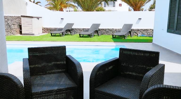 Vacation home with patio, barbecue & yard in Yaiza
