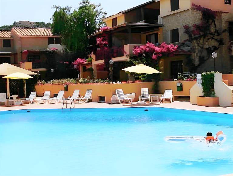 Serviced apartment with patio, pool & garden in Arzachena