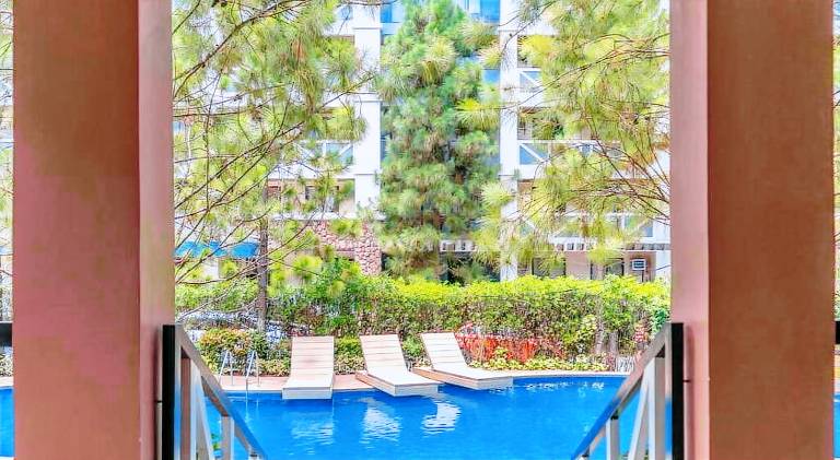 PineSuites Relaxing 2-bedroom condo with pool and garden view accepts small pets only — photo 4