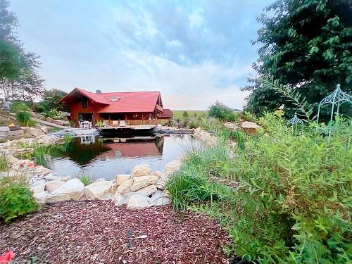 Blockbohlen HolzHaus mit Sauna, Outdoor Jacuzzi und BadeTeich in Poppenhausen