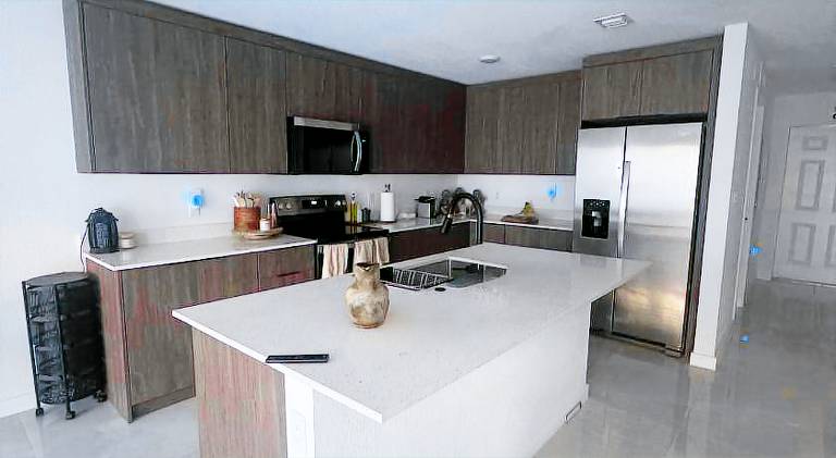 Modern townhome with kitchen and backyard access — photo 3