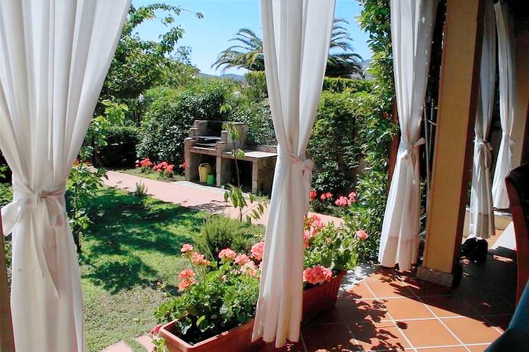 Vacation home with yard, terrace & grill in San Teodoro
