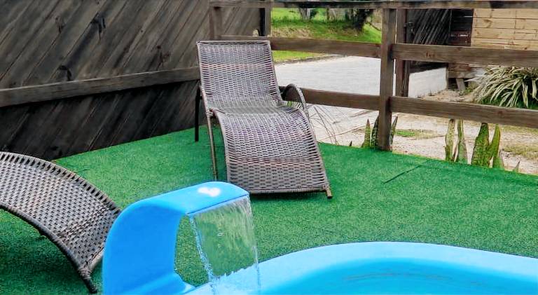 Holiday apartment with patio, pool & yard in Imbituba