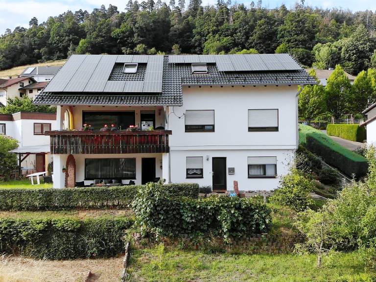 Holiday apartment with yard, terrace & BBQ | Garden view — photo 2
