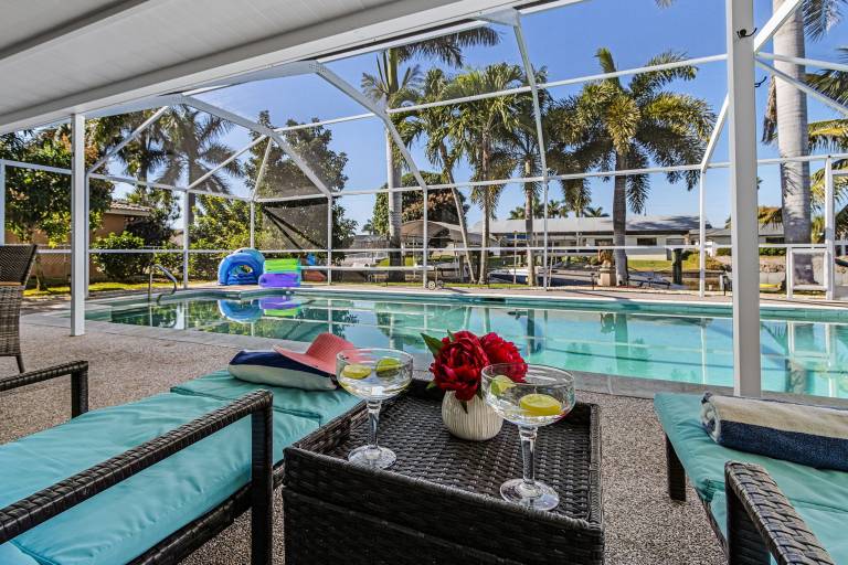 Family-friendly big vacation home with garden, private pool & barbeque | River view | Pet-friendly in Cape Coral, FL