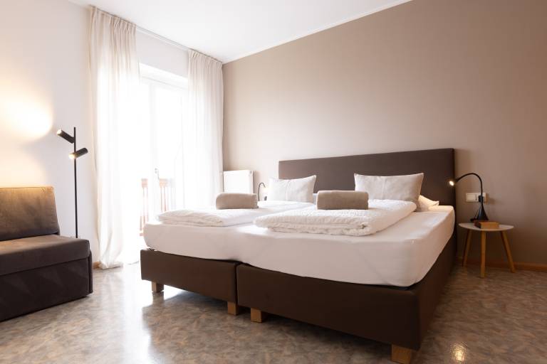 Lovingly Furnished Apartment with Balcony and Stunning City Views at Residence Margreth in Marlengo