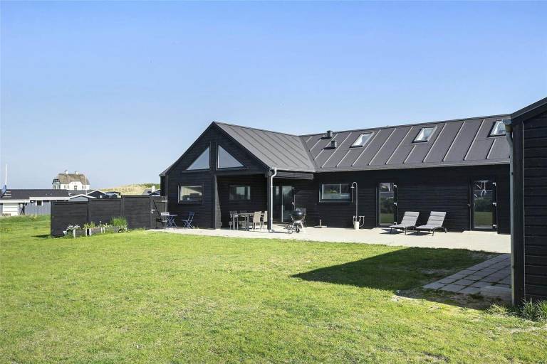 Vacation home with barbeque, sauna & terrace in Lokken