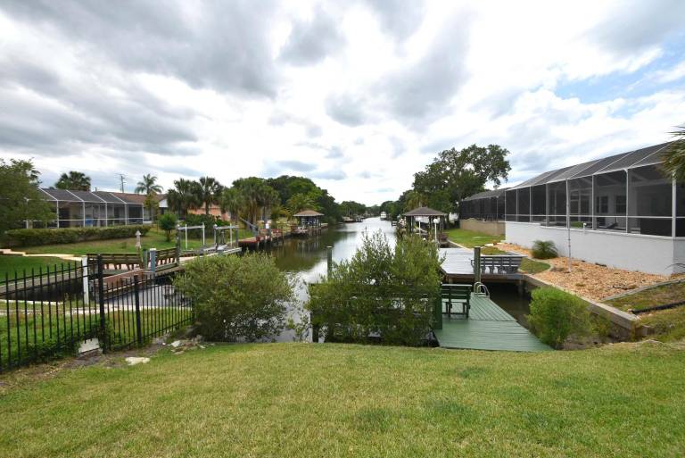 Salty Breeze Canal Front Pool Home W boat dock — photo 3