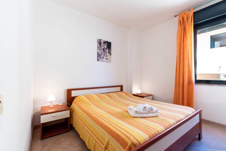 Rental apartment with patio & garden | City view in Villasimius