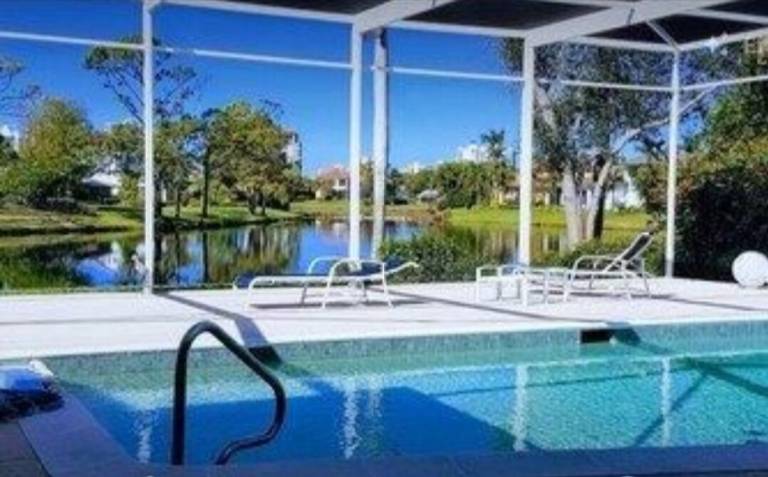 Vacation home with private pool, yard & terrace | Garden view in Naples, FL