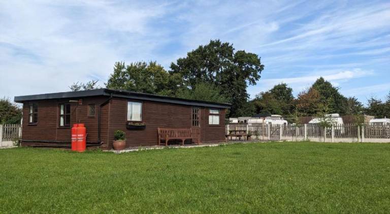 Log cabin with secure garden