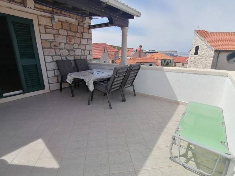 Two bedroom apartment with terrace and sea view Postira, Brač (A-25147-a) in Postira