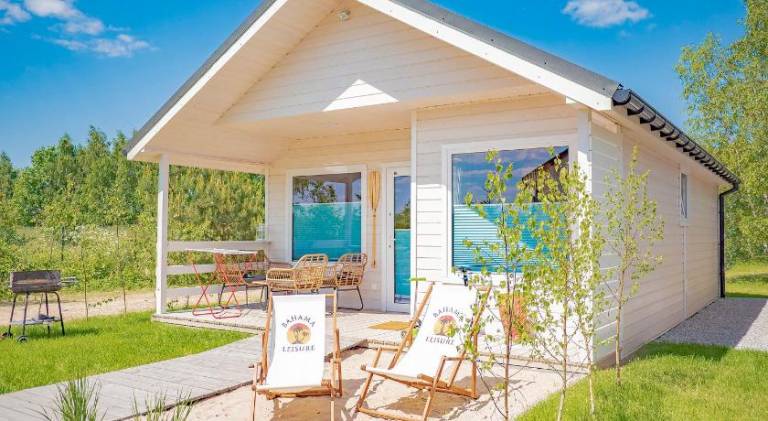 Lodge with patio, yard & BBQ in Darlowo