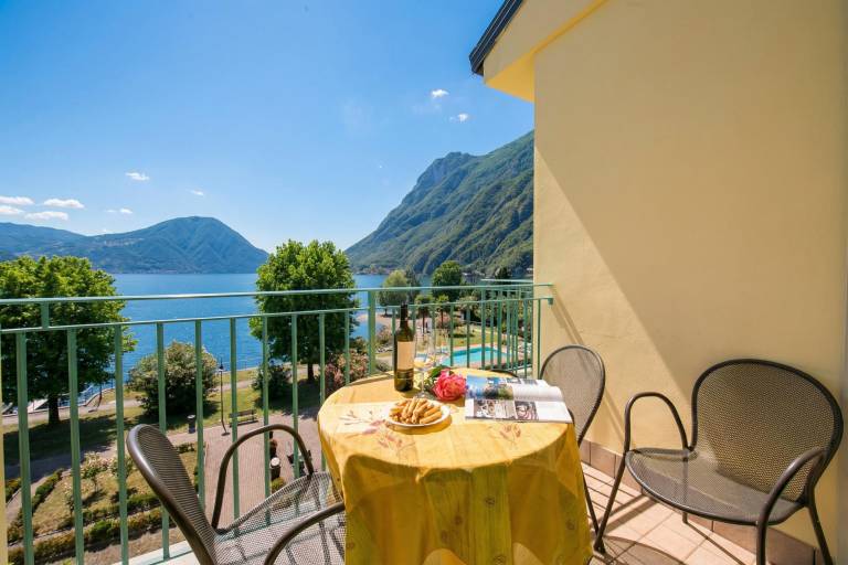Family-oriented holiday apartment with patio | Water view | Beach nearby | Pet-friendly in Porlezza