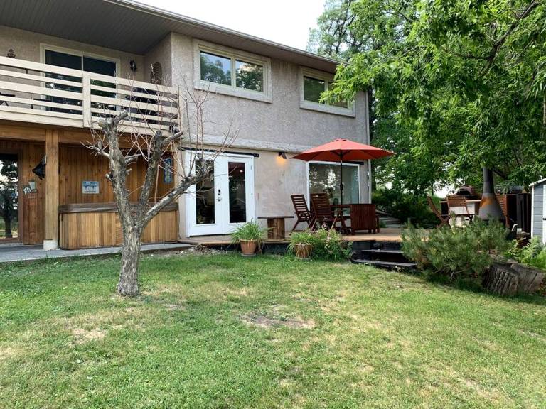 Incredible Waterfront Cottage with Hot-tub, Barbecue and Fire Pit in Portage la Prairie, Manitoba in Portage La Prairie, MB