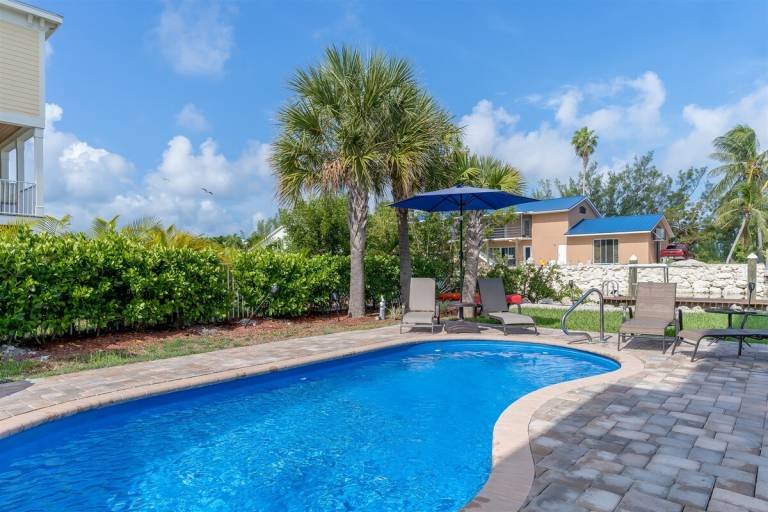 Adventures in Paradise at Sombrero Beach Pet friendly waterfront pool home, 26' dock in Marathon, FL