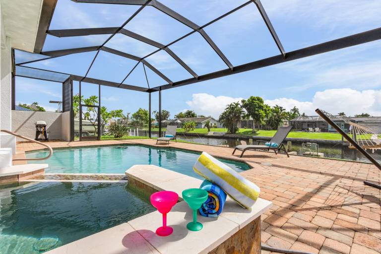 Vacation home with hot tub, grill & private pool | Water view — photo 2