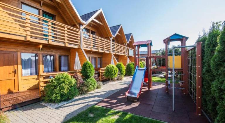 Lodge with yard, terrace & grill in Mielno