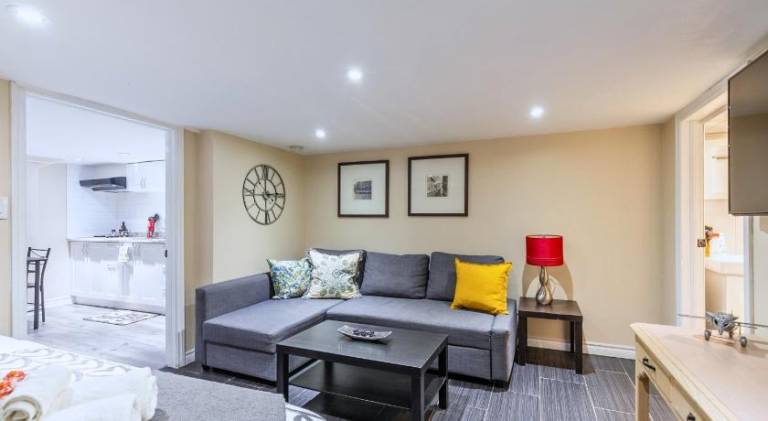 Cozy Basement Suite with Parking Steps to Transit St Clair Hotel