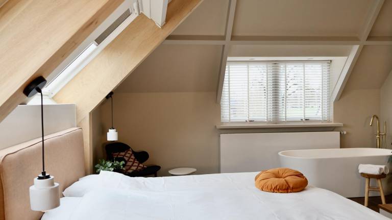 Luxurious suite with river meadow views modern amenities and an elegant relaxing atmosphere