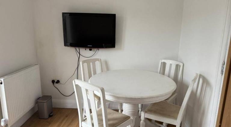 Private guest suite inside a family home with own entrance, kitchen, and bathroom — photo 4
