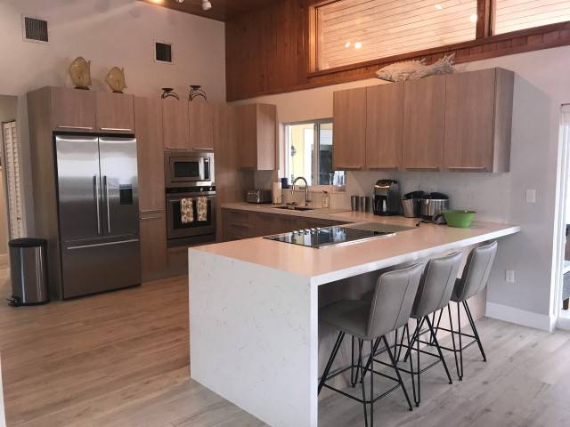 Beautiful Canal front Home with Above Ground Pool, Dock and Fish Cleaning Station — photo 4