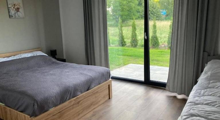 Apartment with barbecue, garden & patio in Mikolajki