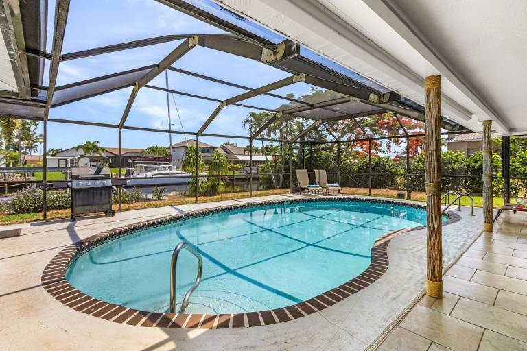 Vacation home with barbeque & private pool | Water view in Cape Coral, FL