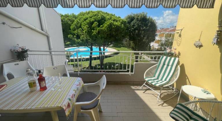 Apartment with pool, terrace & yard in Caorle
